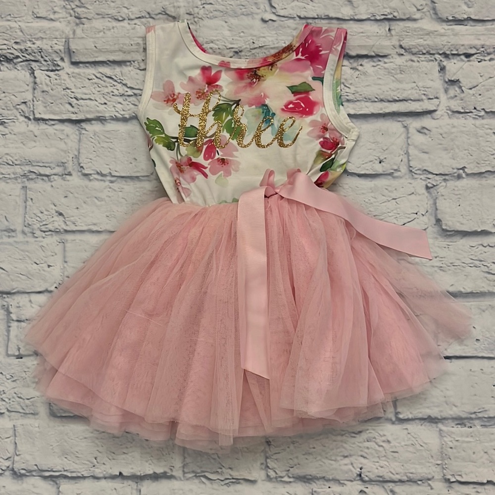 Grace and Lucille fancy dress for 3 year old. Gold script with Three on front.